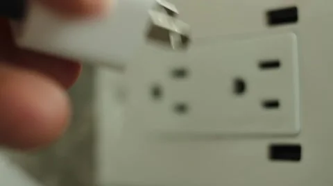 Plugging in mobile device to AC power Stock Footage 41680652