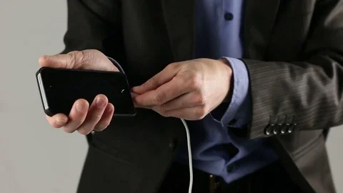 Plugging in mobile device (plug in/ plug out) Stock Footage 74818845