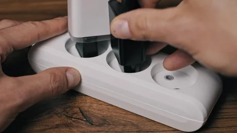 Plugging Multiple Devices into Power Strip 動画素材 320573580