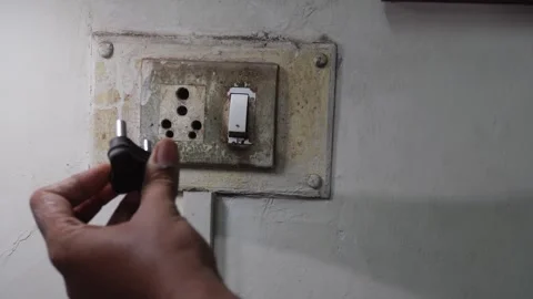 Plugging in the old light board, turning on the light Stock Footage 246594760