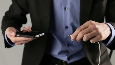 Plugging in (out) charging cable Iphone. Stock Footage 74818842