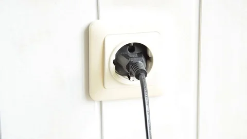 Plugging off from outlet to save energy Stock Footage 129767916
