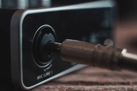 Plugging a p10 cable into an audio interface Stock Photos