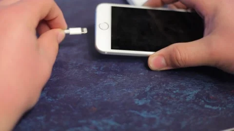 Plugging in Phone to charge Stock Footage 53246482