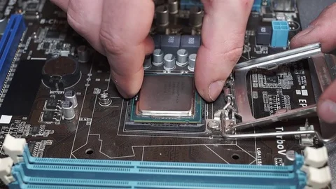 Plugging a Processor in to the Motherboard Stock Footage 72679758