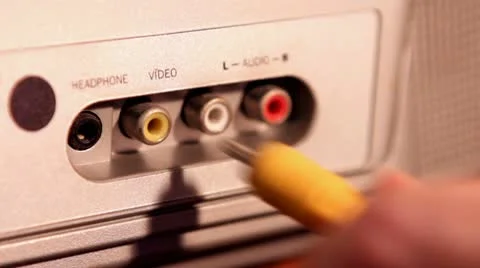 Plugging in RCA cables to TV Stock Footage