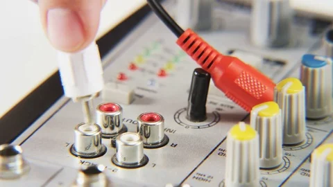 Plugging Red and White Cables Stock Footage 70998736