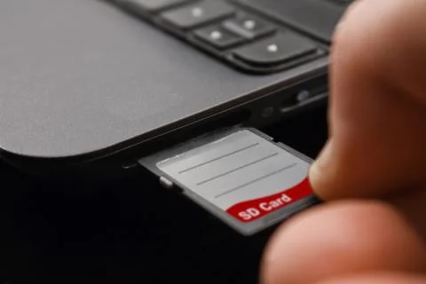 Plugging in sdxc memory card Stock Photos