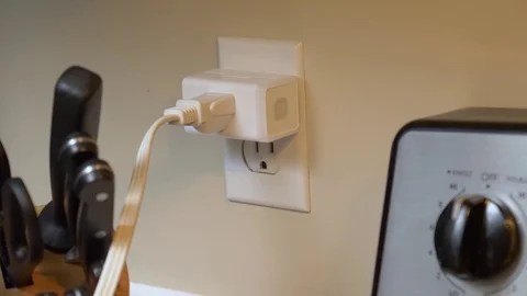 Plugging Smart Plug Into Kitchen Wall Socket At Home Automation House Stock Footage 121691779
