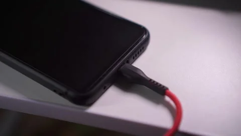 Plugging smartphone charging type c Stock Footage 273424361