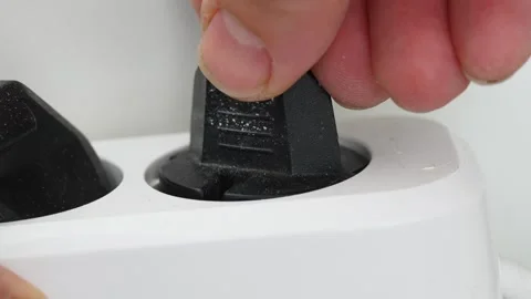 Plugging a socket plug into a double extension cord Stock Footage 244472608