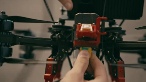 Plugging something into an FPV drone Stock Footage 263992988