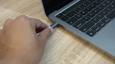 Plugging In A USB-C Adapter To a Modern Notebook Computer. Close-up. Stock Footage 293127701