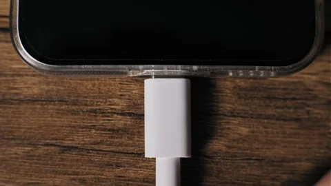 Plugging USB-C Cable Into Smartphone Top Down View Stock Footage 320573926