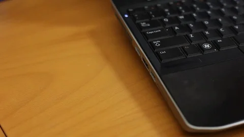 Plugging in a USB security token. Stockbeeldmateriaal 72251674