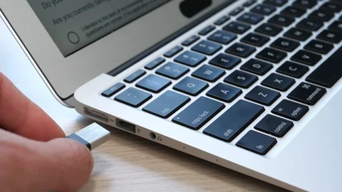Plugging an USB Stick into a USB Port of a Laptop Computer Stock Footage 90018852
