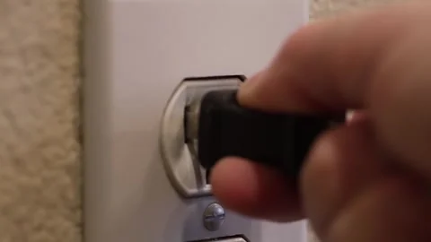 Plugging in wall socket - side Stock Footage 322189388