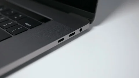 Plugging in a white USB-C / Type C cable to a modern notebook Video stock 95126636