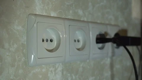 Plugs of electrical appliances are inserted into 4 connected sockets in turn 스톡 동영상 259313837
