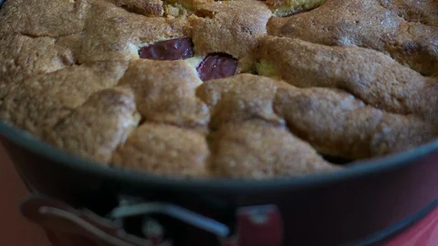A Plum Cake Base In A Form Stock Footage 89735135
