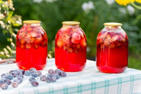 Plum compote home canning in the garden Stock Photos