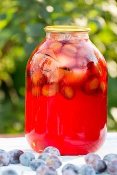 Plum compote home canning in the garden Stock Photos