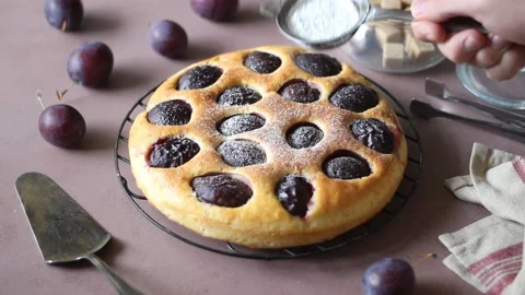Plum pie on a pink background. Baking. Vegetarian food. Stock Footage 165586068