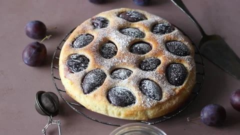 Plum pie on a pink background. Baking. Vegetarian food. Stock Footage 165586074