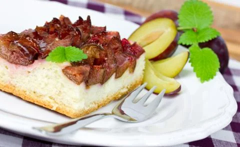 Plum pie on plate Stock Photos