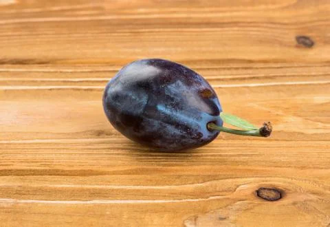 Plum on a table Stock Photos