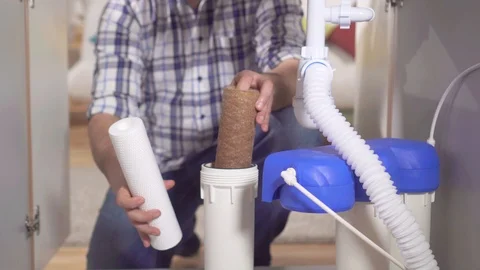 Plumber change the filter element in the water filter Stock Footage 121799968
