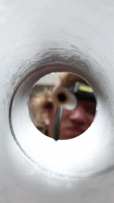 Plumber checks pipe interior Stock Footage 337160486