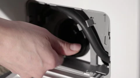 Plumber cleaning washing machine pump filter. Stock Footage 332640138