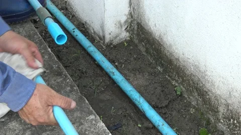 Plumber connect plastic plumbing pipe in the evening. Stock Footage 166906155