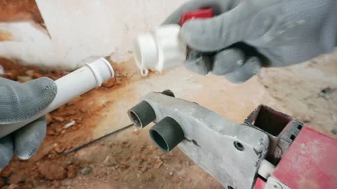 A plumber connects polypropylene pipes. Stock Footage 273344625