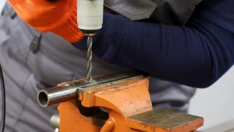 Plumber drilling a metal pipe Stock Footage 279074670