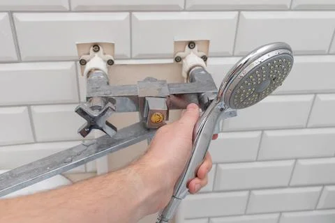 Plumber fixed leaking shower head Foto stock