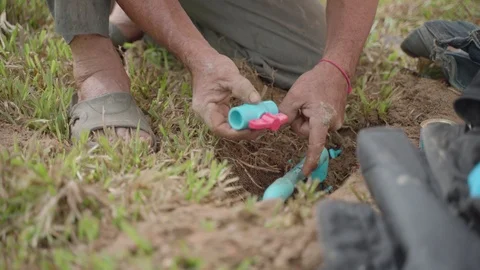Plumber fixing broken water pipe Stock Footage 117287825