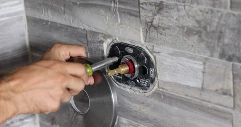 Plumber fixing shower. Workman repairing shower in bathroom. Stock Footage 120670544