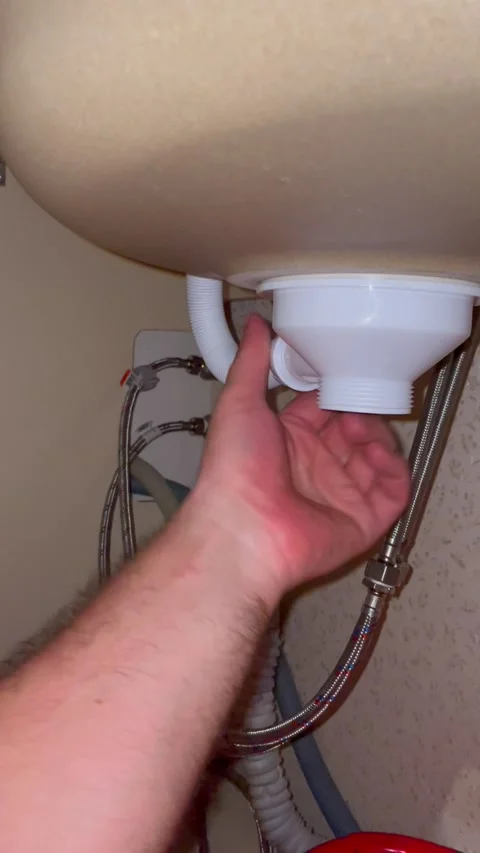 Plumber hands installing kitchen sink drain pipe. Man repairing water plumbing Stock Footage 340124668