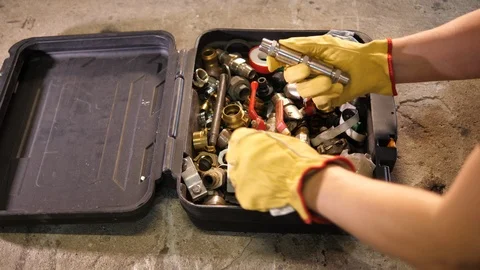 Plumber Handyman looking for pipline tools with Valves. Carpentry Toolbox. Stockbeeldmateriaal 126344970