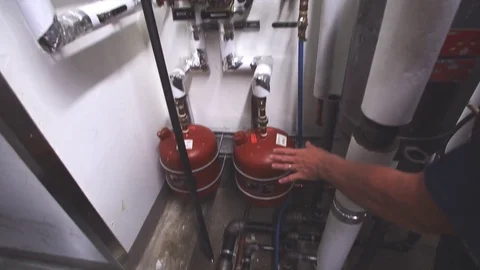 Plumber inspecting pipes 库存影片 70459858