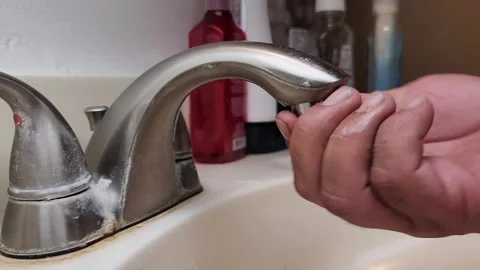 Plumber installing new filter for faucet  Stock Footage 249924051