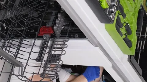 A plumber installing a sink in the kitchen room. Repair work in a new building Video stock 250027467