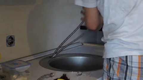 Plumber installs the crane Stock Footage 74526344