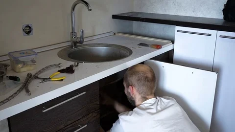 Plumber installs the crane Stock Footage 74527878