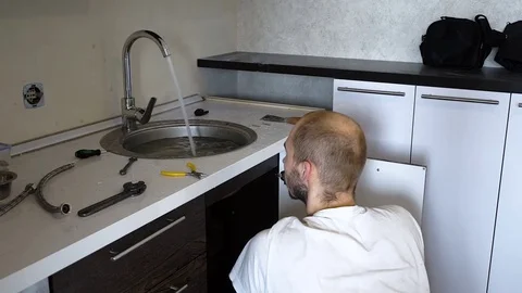 Plumber installs the crane Stock Footage 74583509
