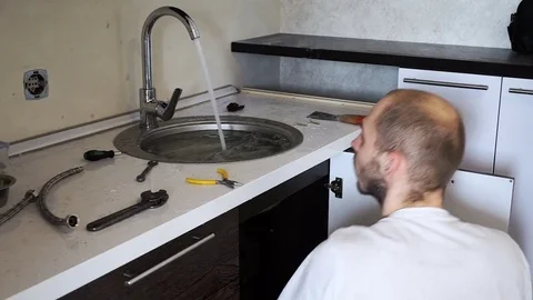 Plumber installs the crane Stock Footage 74588930