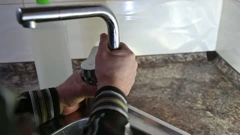 Plumber installs the crane. A man repairs a crane Stock Footage 162300488
