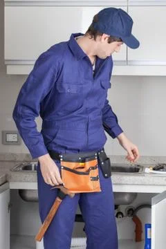 The plumber in the kitchen Stock Photos